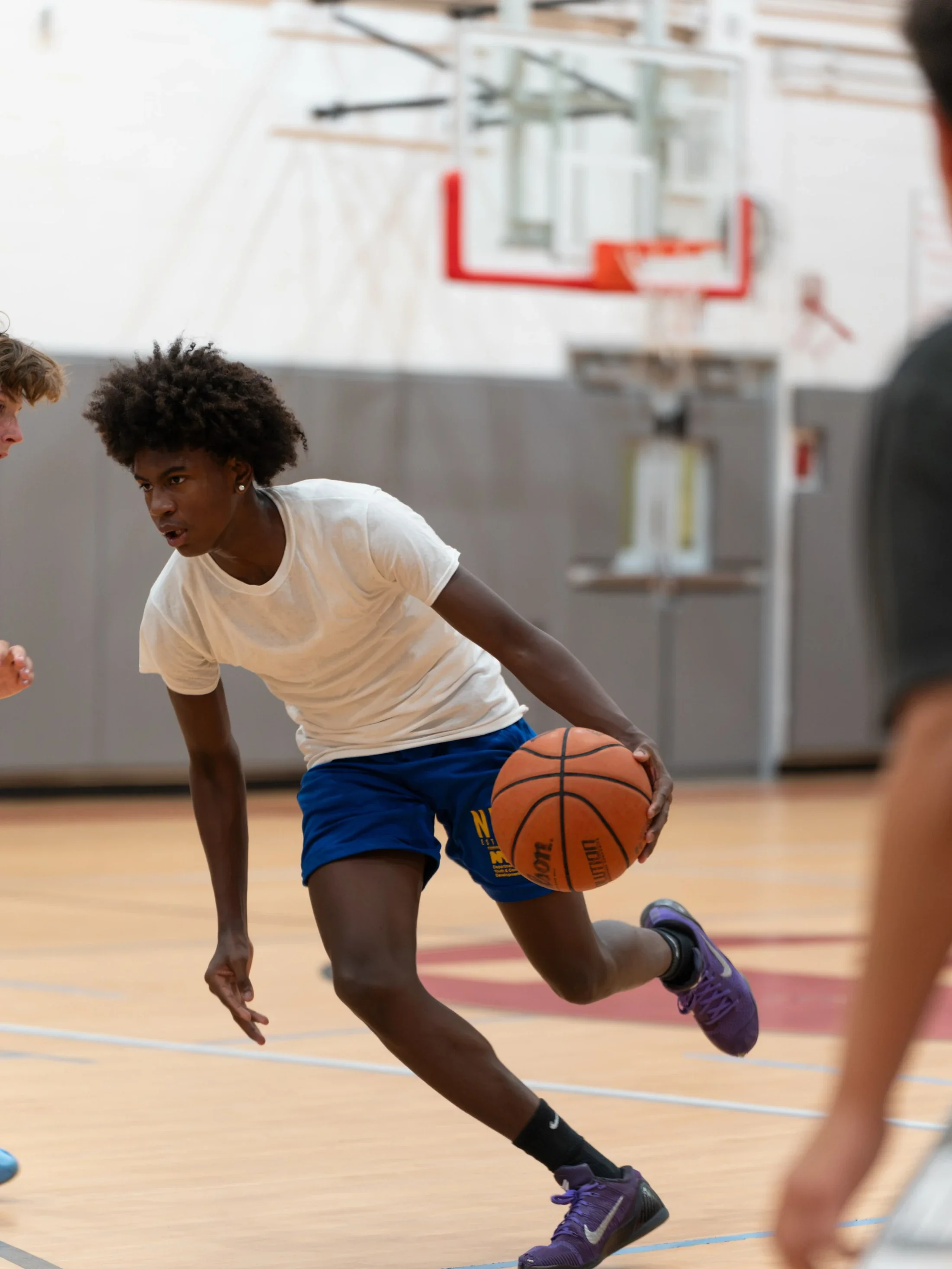 A player driving with the basketball during a Pro Reps session